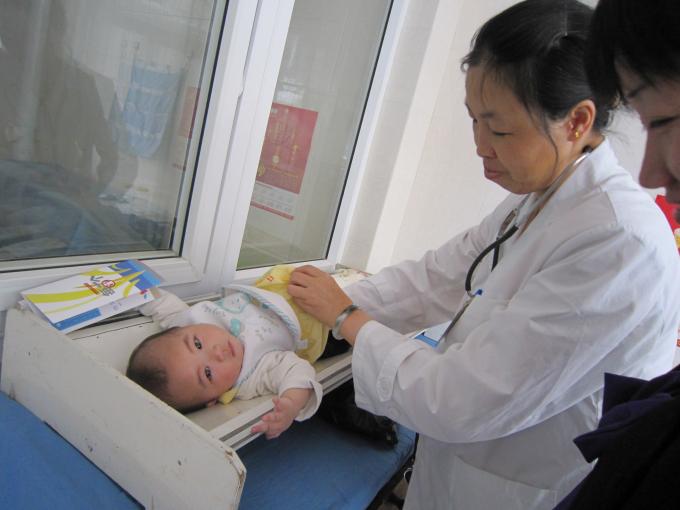 A doctor examines a baby’s development at a health facility in Kunming City, Yunnan, China.